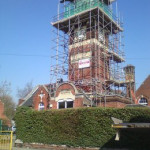 working on top of a high tower